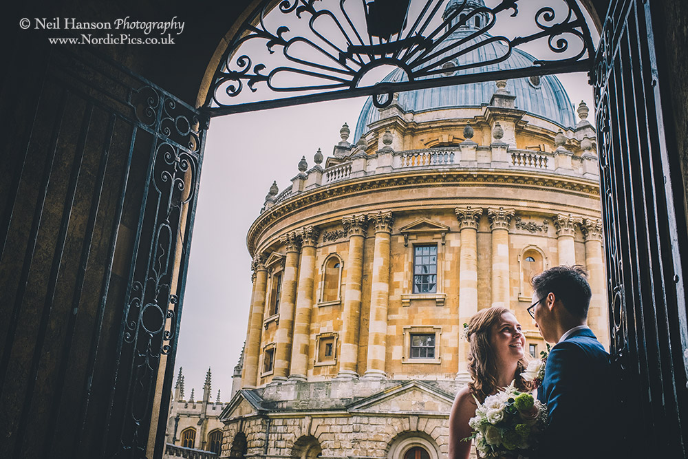 Bride and Groom outside tHe Radcliffe Camera in Oxford on their Wedding Day