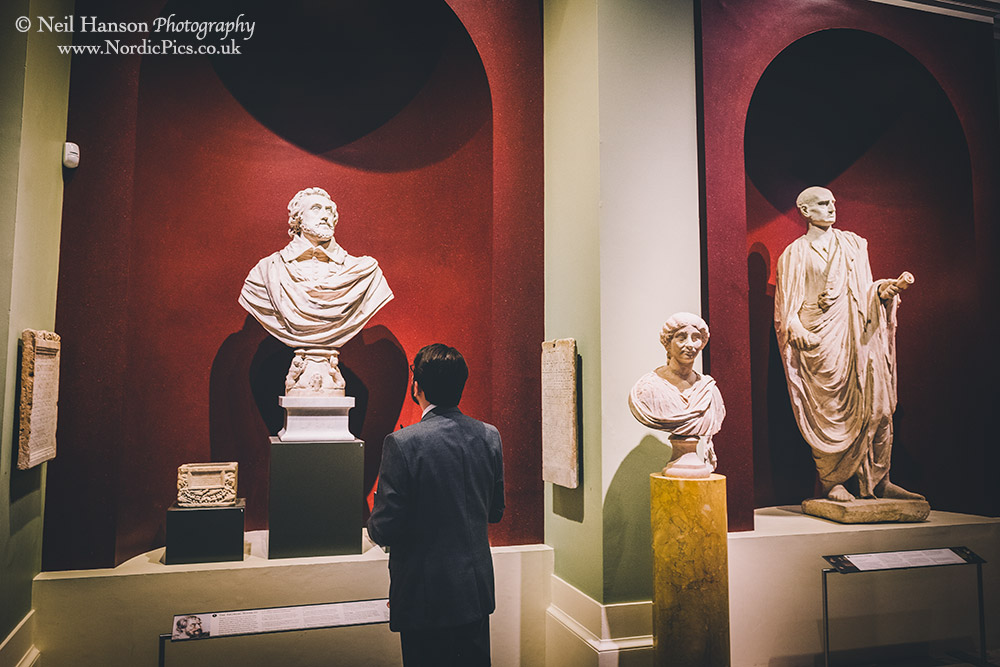 Wedding guests admiring the Ashmolean museum statues 