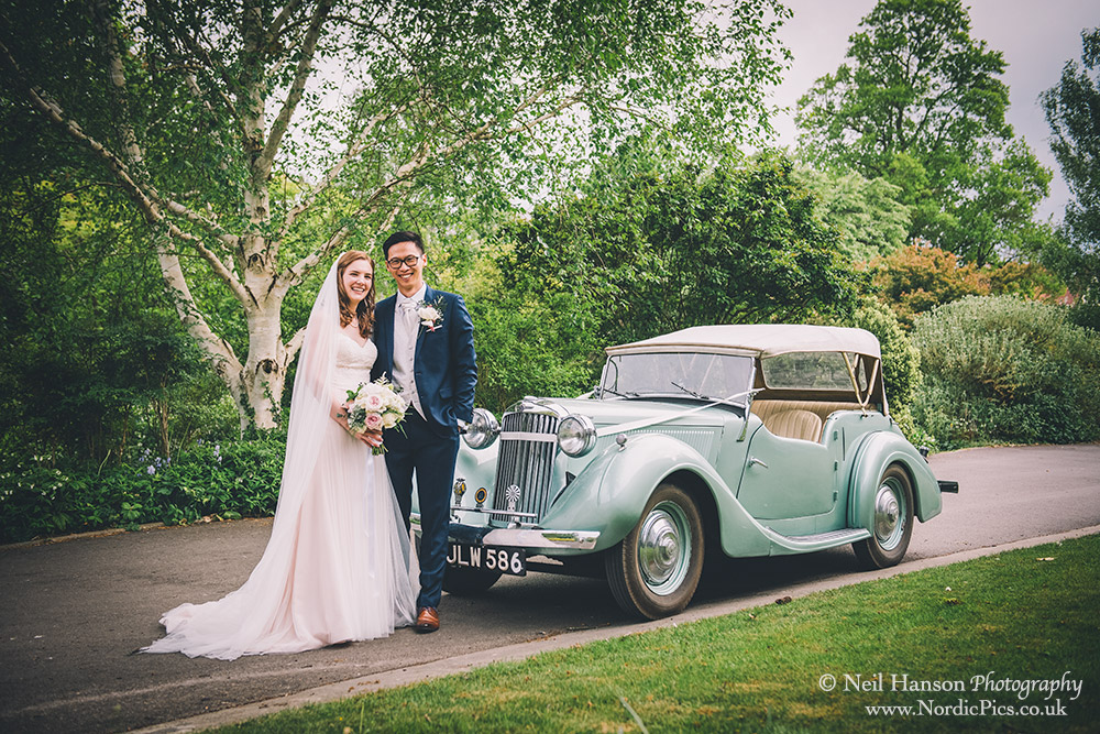 Bride and Groom with their wedding car at The Cherwell Boathouse