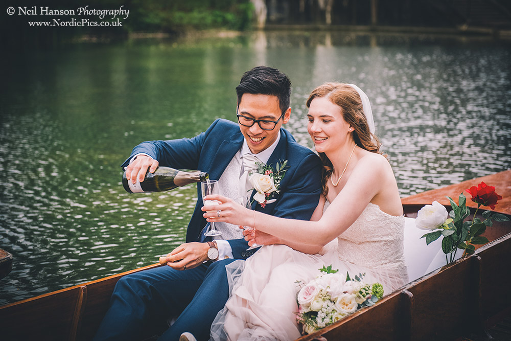 Champaign on punts in Oxford with a bride & groom
