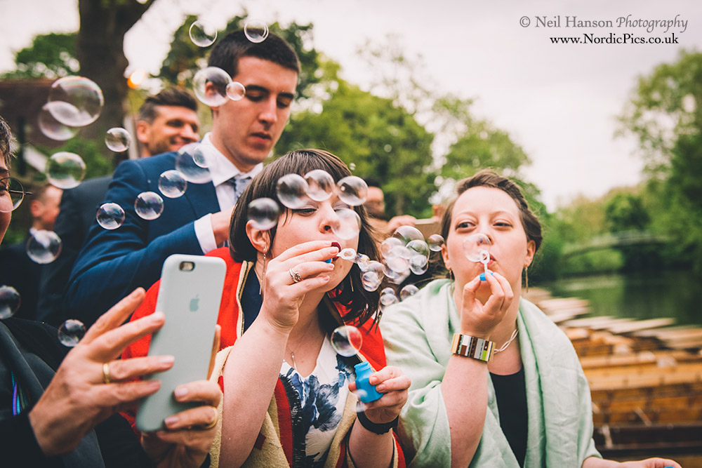 Wedding guests blowing bubbles