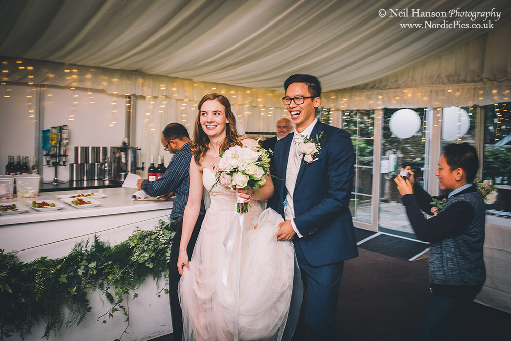 Bride and Groom enter their wedding breakfast at the Cherwell Boathouse in Oxford