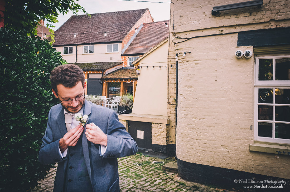 Groomsman preparing for a wedding at The Crown and Thistle Abingdon