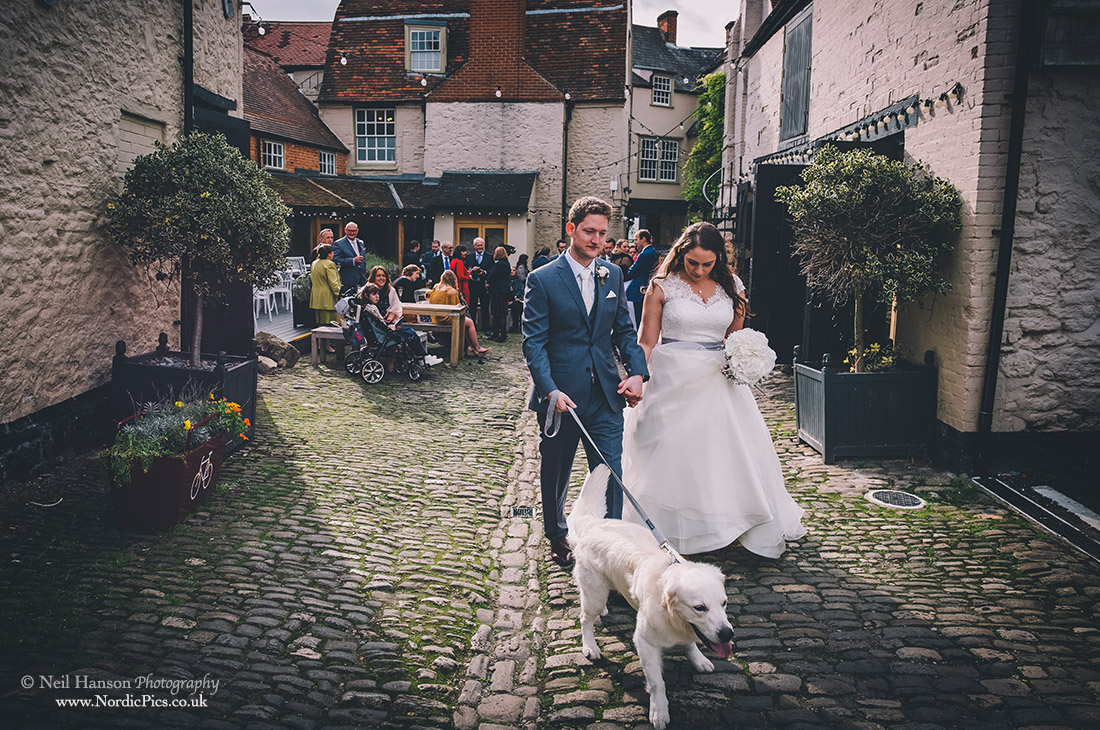 Bride and Groom taking their dog for a walk in Abingdon