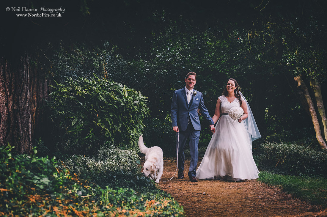 Bride and Groom dog walking