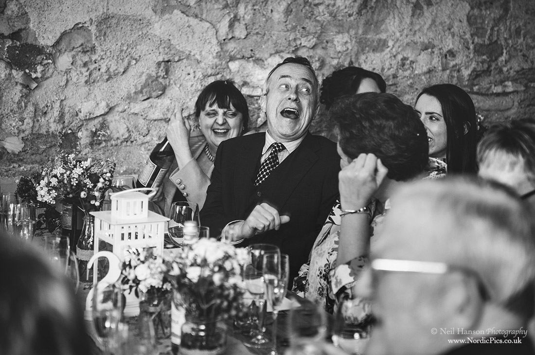 Wedding guest laughing at the speeches