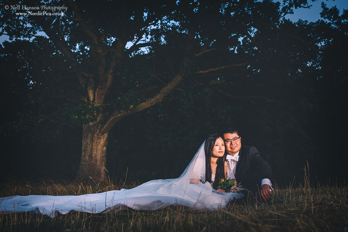 Watching the sunset on their Asian pre-wedding in The Cotswolds