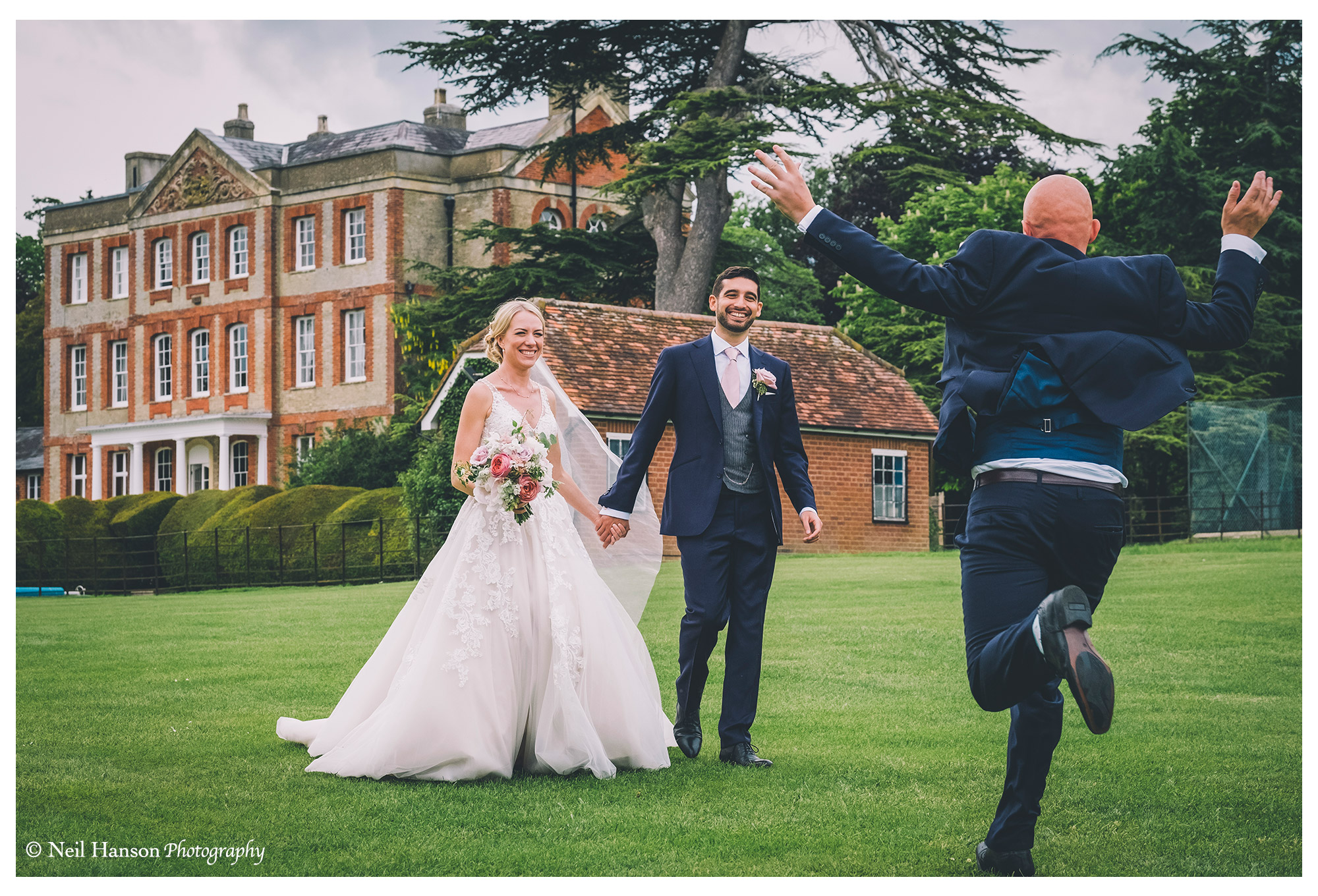 Wedding guest greets the bride and groom at Ardington House in Oxfordshire