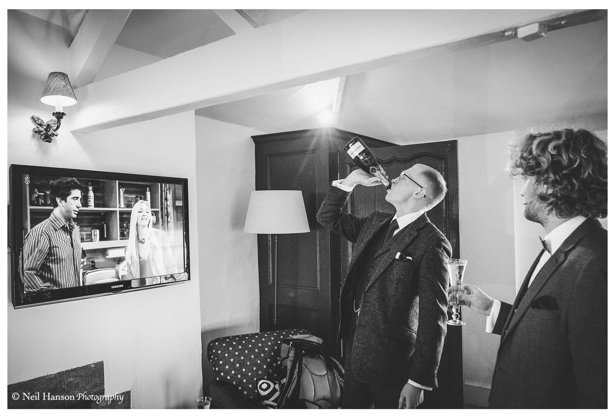 Last minute swig of Champaign for the groom at a Bay Tree Hotel Wedding