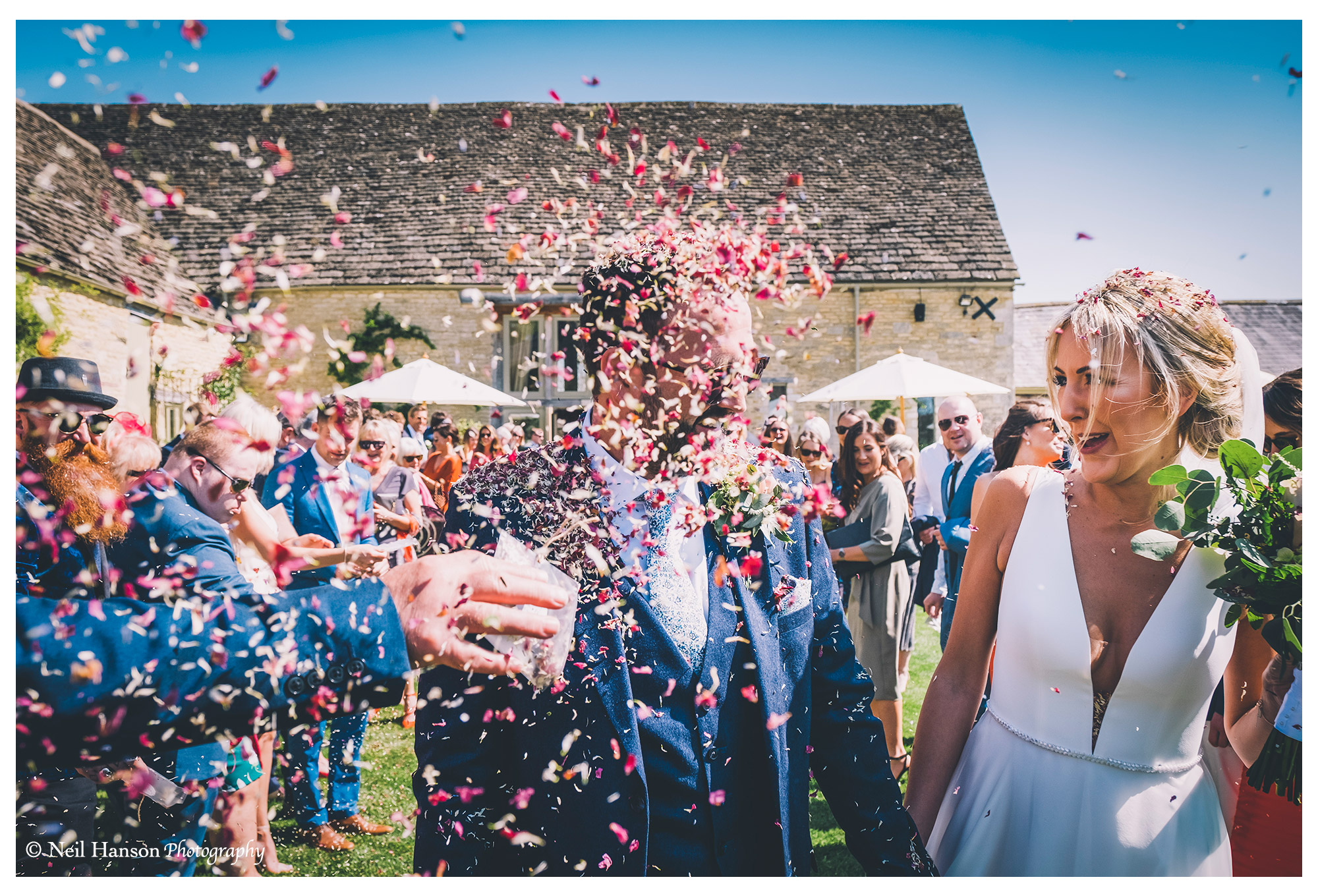 Confetti in the face for the groom at Caswell House