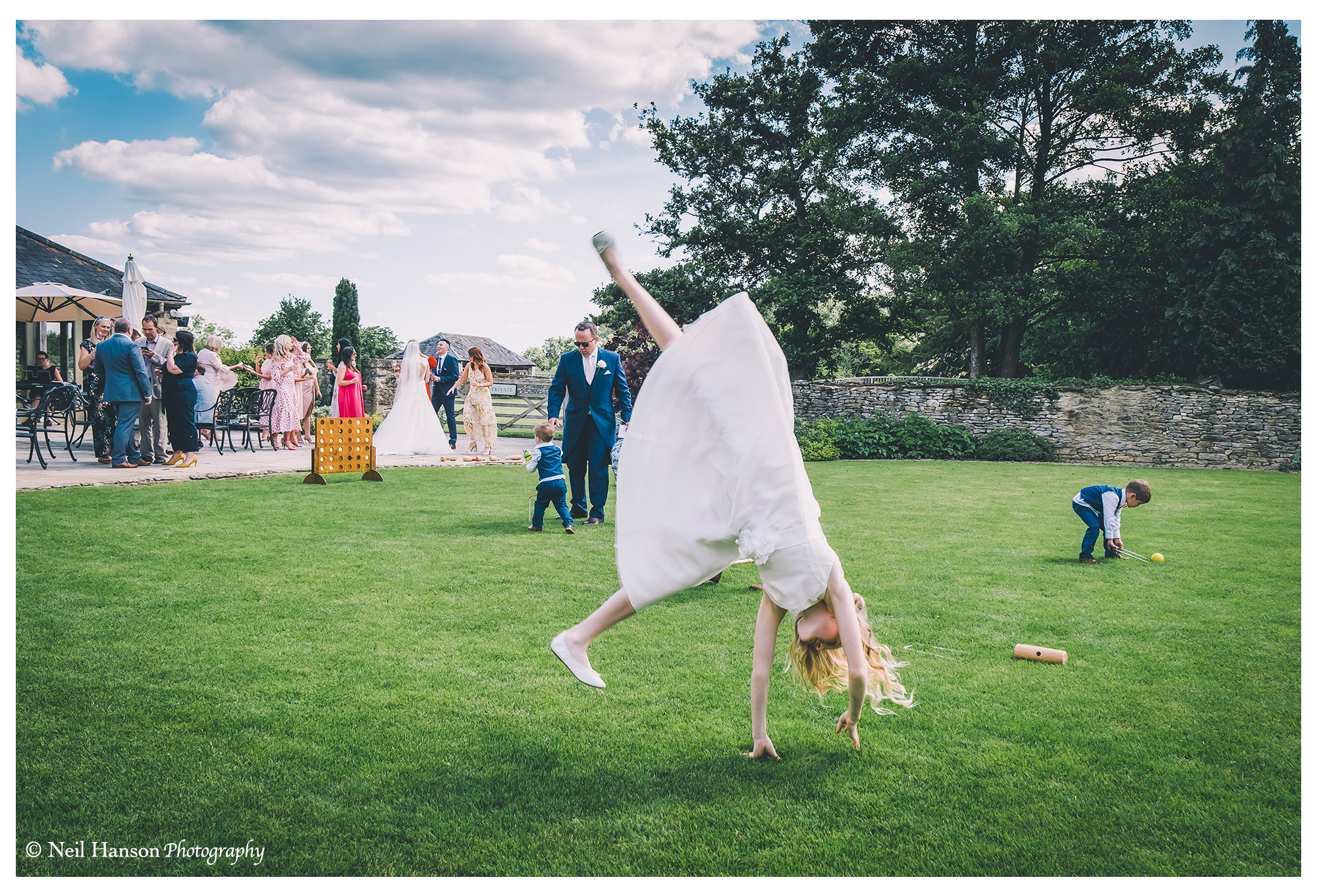 Bridesmaid acrobatics at a Caswell House Wedding