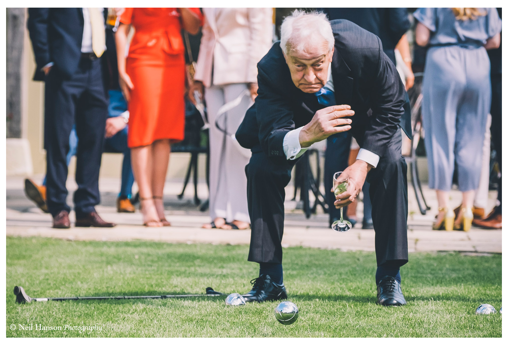 Grandad playing bowls at a caswell house wedding