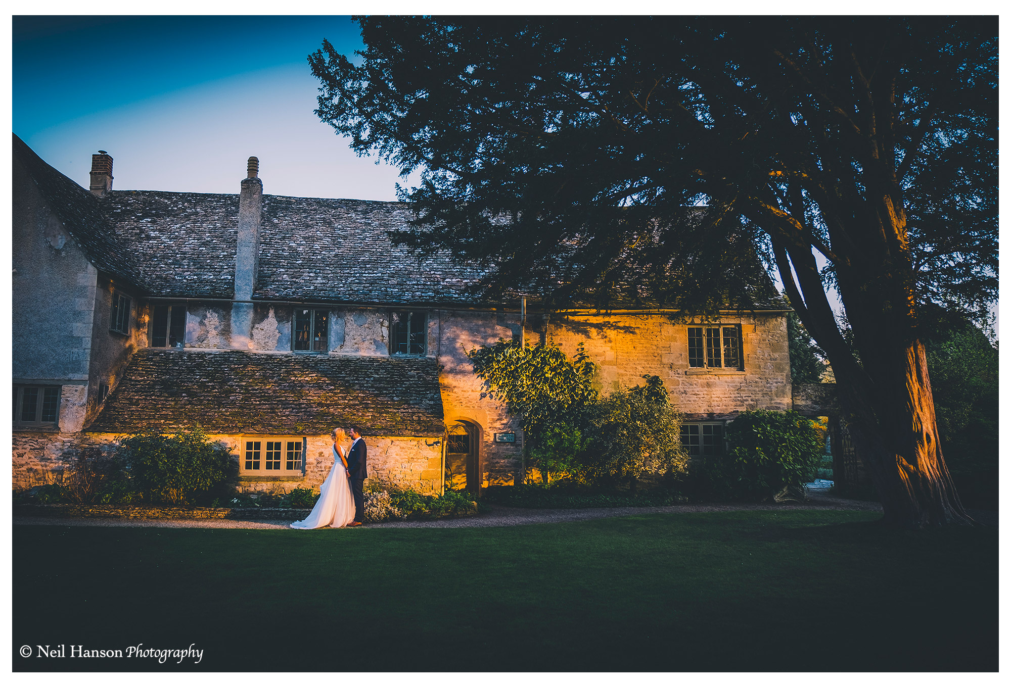 Evening sunset with a bride and groom at Caswell House