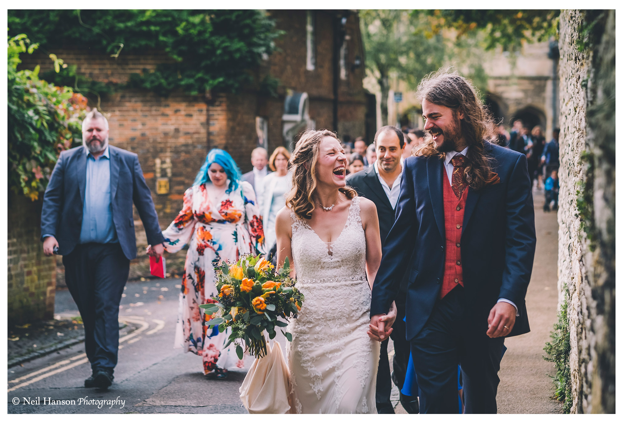 Bride & Grooms lead their guests to a wedding at Cosener's House in Abingdon