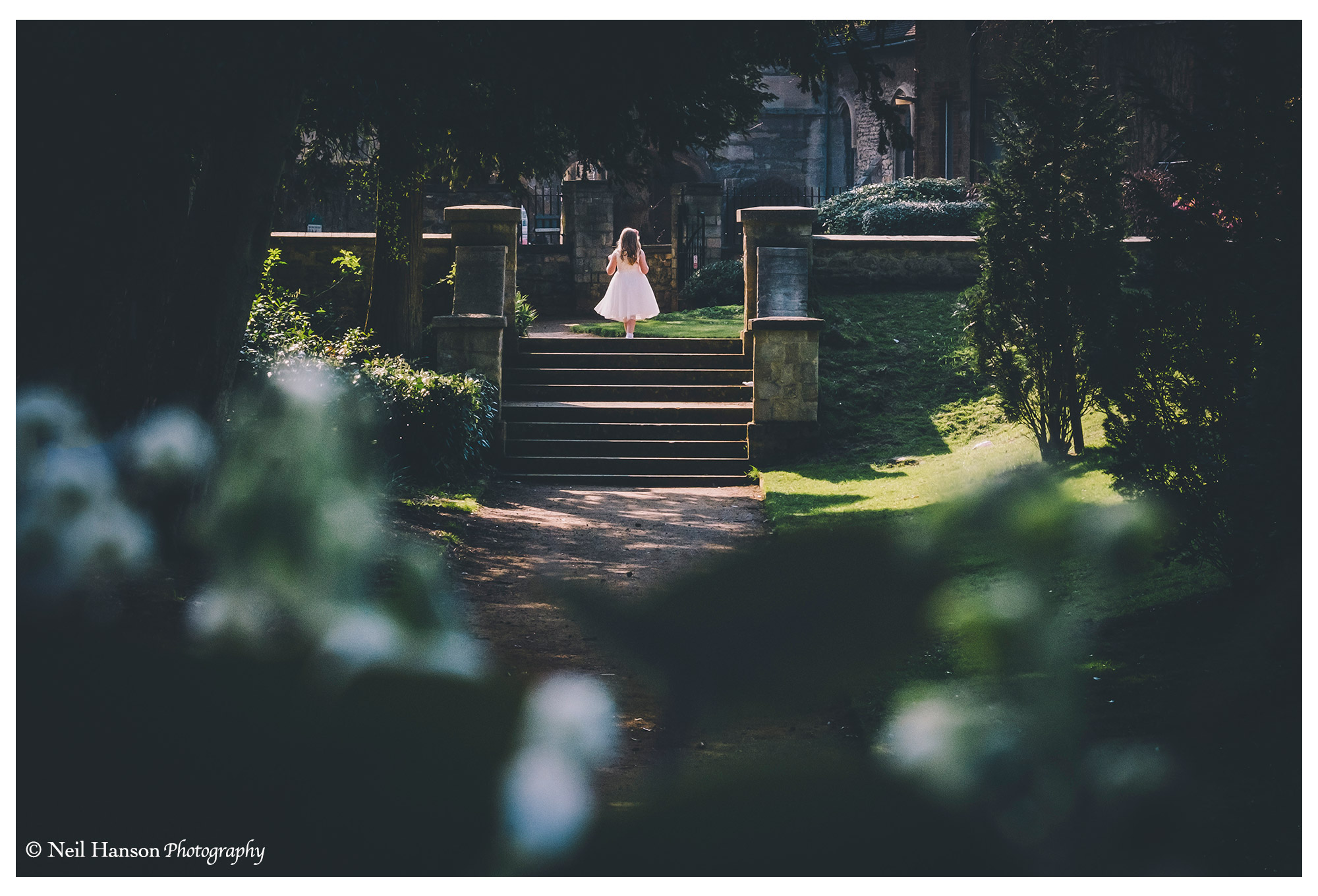 A flower girl in the grounds of Abbey gardens in Abingdon