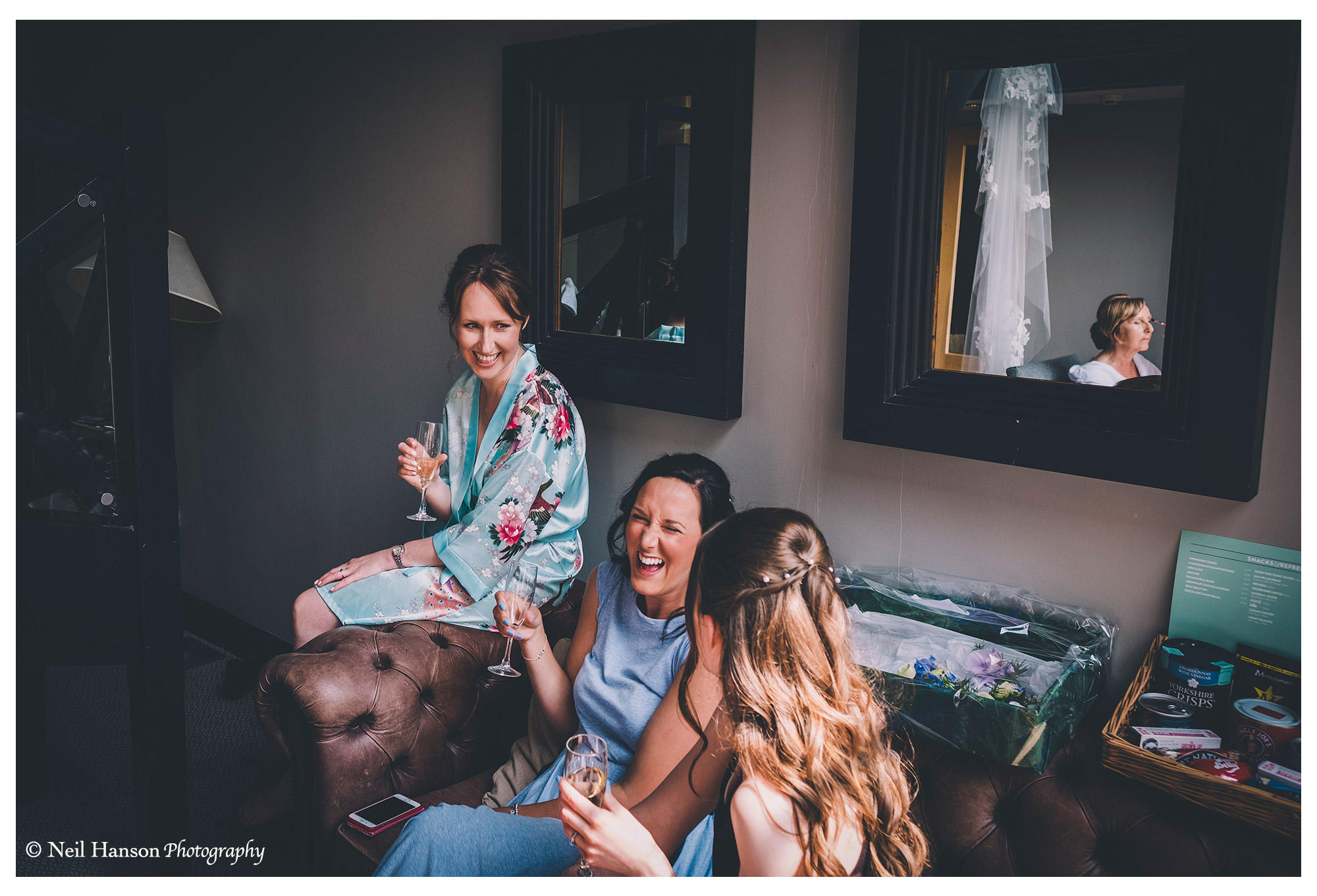 Bride and her bridesmaids enjoying Champaign during the morning preparations