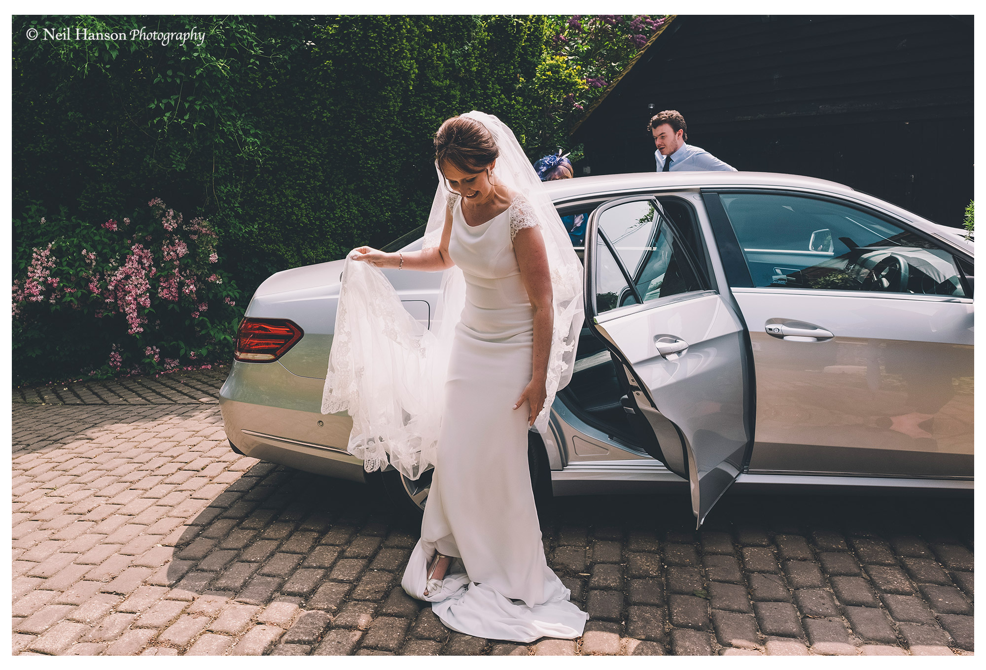 The bride arrives at Old Luxters Barn Wedding