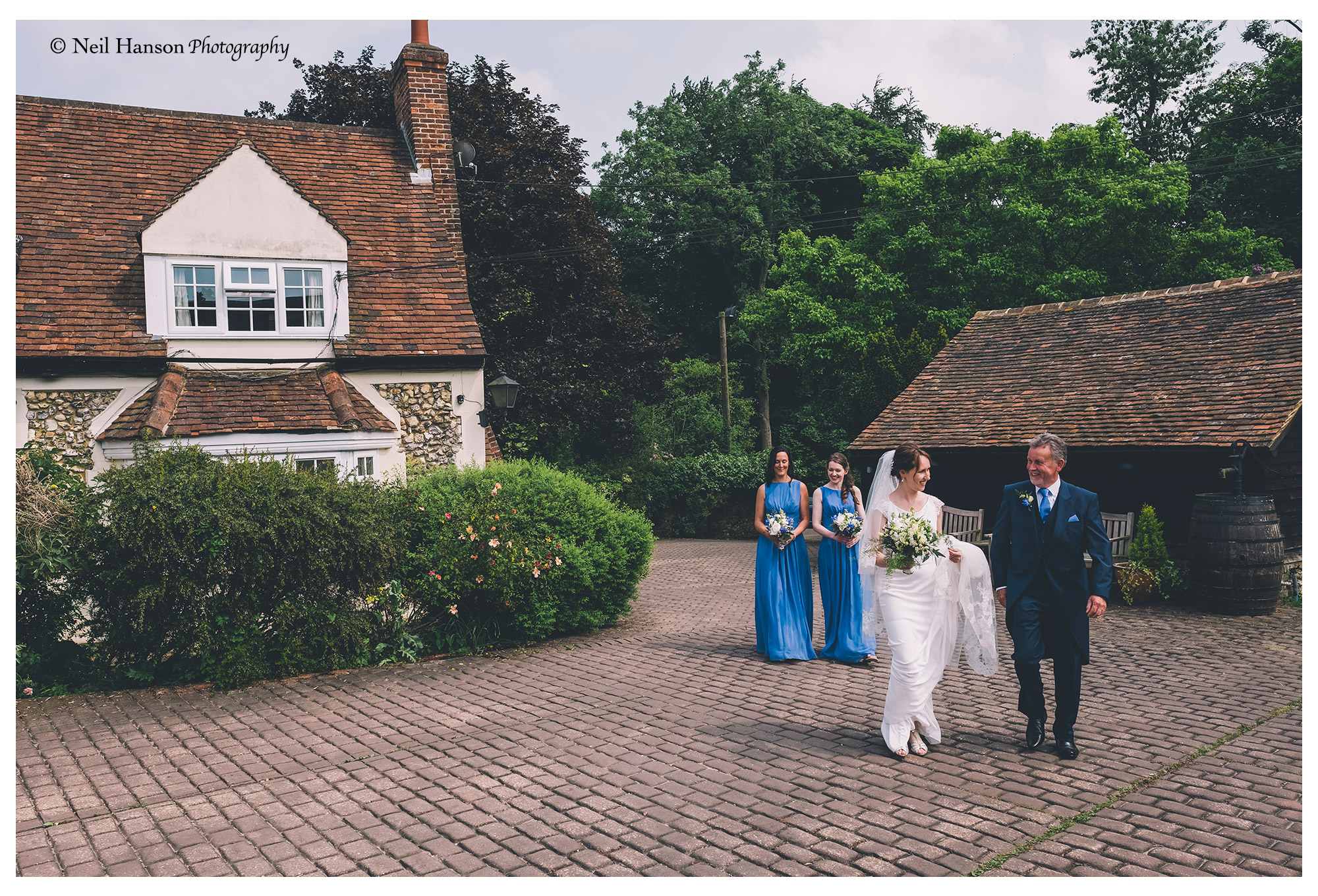 Bride and her father arrive at Old Luxters Barn Wedding