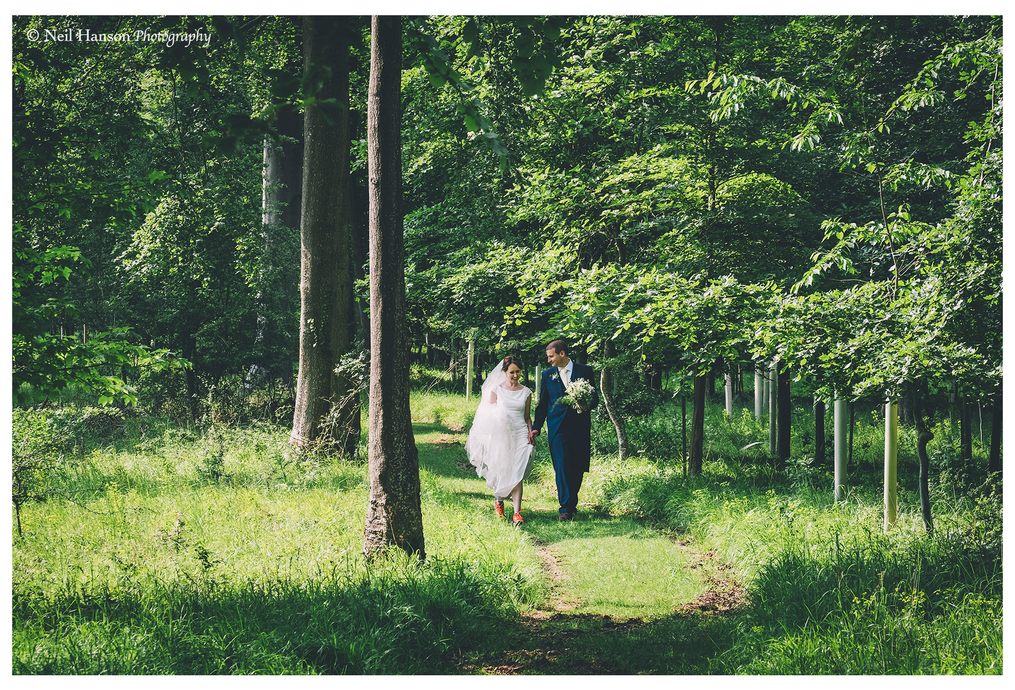 Newley married couple walk in the woods