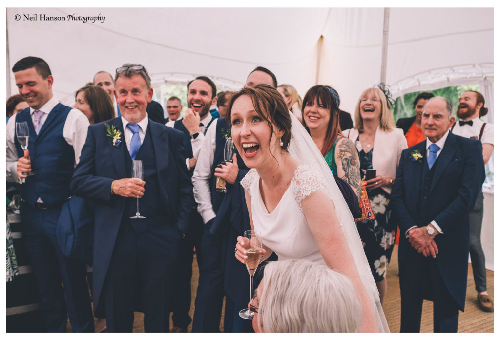 Brides laughter at the grooms speech