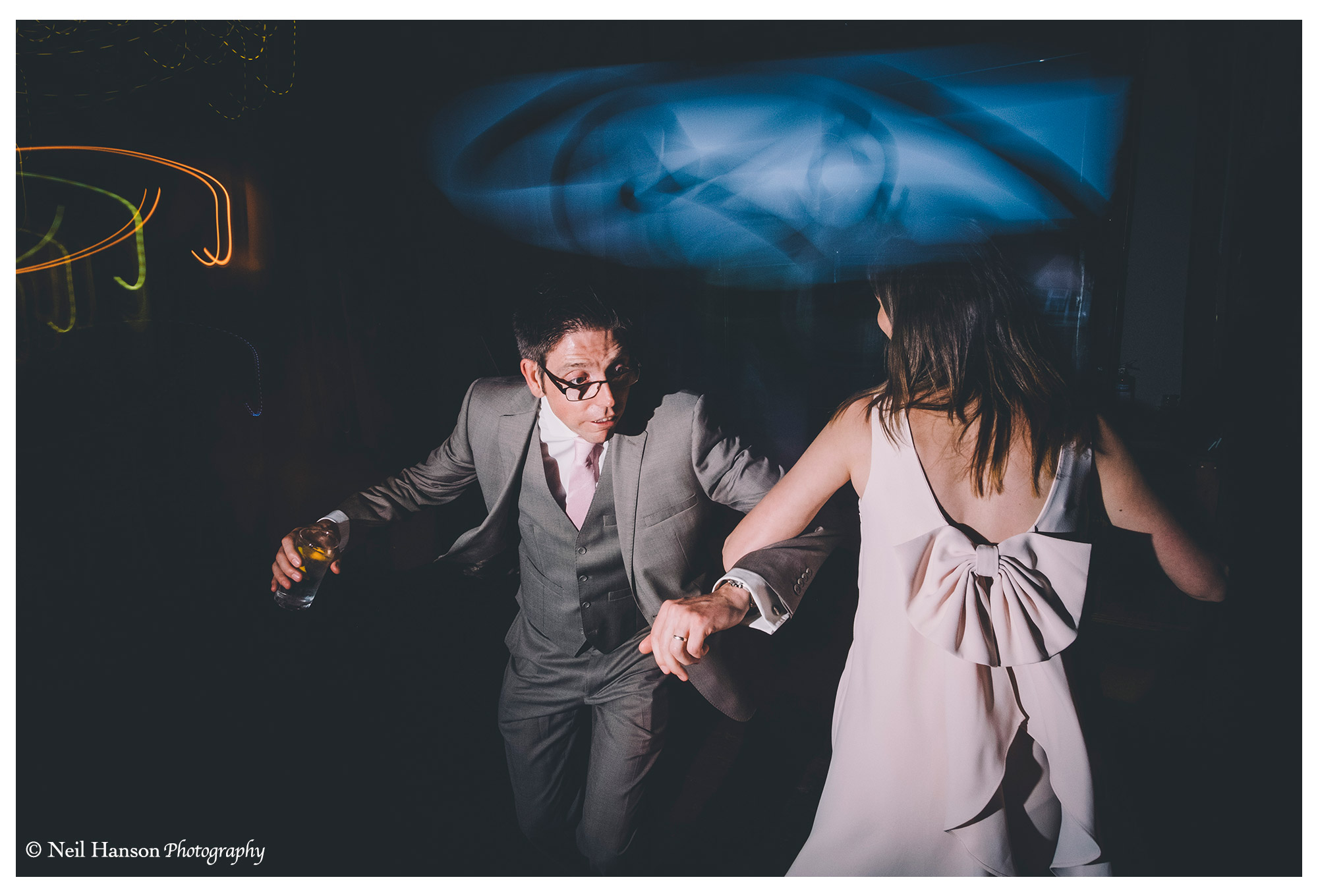 Energetic wedding guests dancing the night away at Old Luxters barn