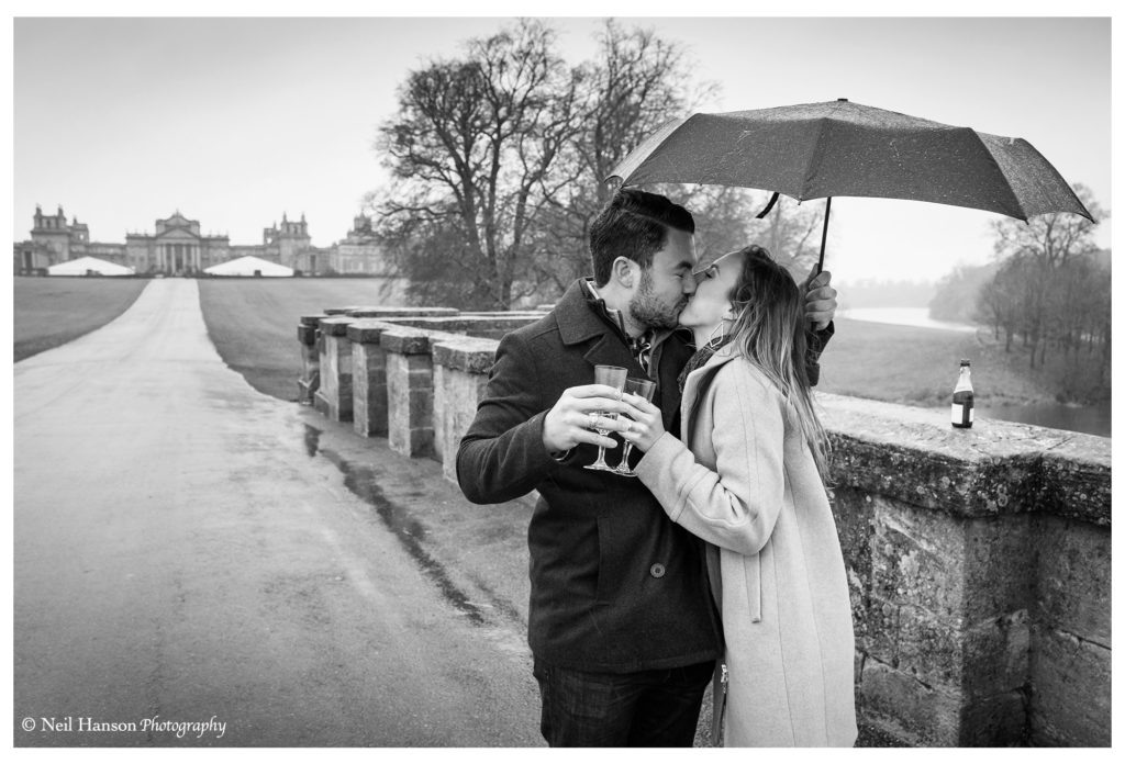 celebrating in the rain at Blenheim Palace after a surprise wedding proposal